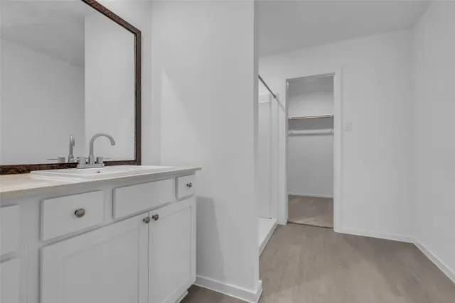 a bathroom with a sink and mirror
