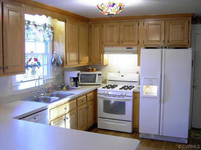 14001 Princess Mary Road Chesterfield, VA 23838 - Photo 8 of 10 a kitchen with stainless steel appliances granite countertop a stove a sink and a refrigerator