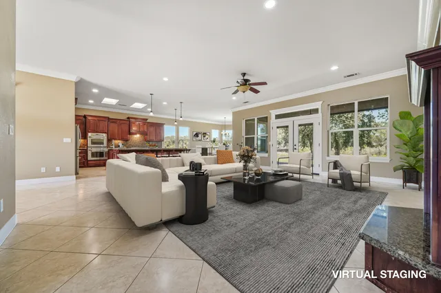 a kitchen with stainless steel appliances granite countertop a stove a sink dishwasher and a refrigerator