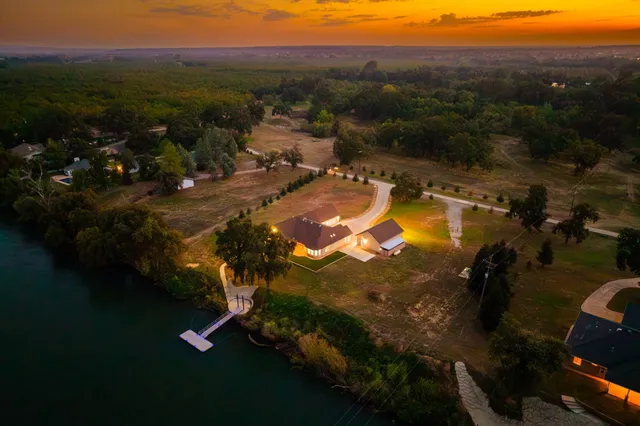 a view of a lake with a house in the background