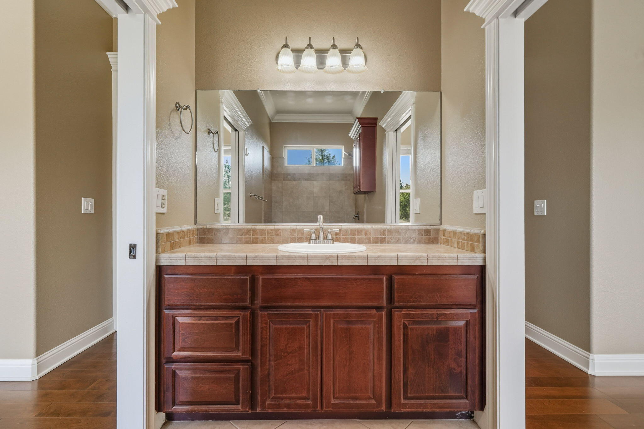 22894 Blue Jay Lane Anderson, CA 96007 - Photo 43 of 62 a bathroom with a granite countertop sink and a mirror