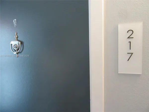 a lamp on a wall with a window