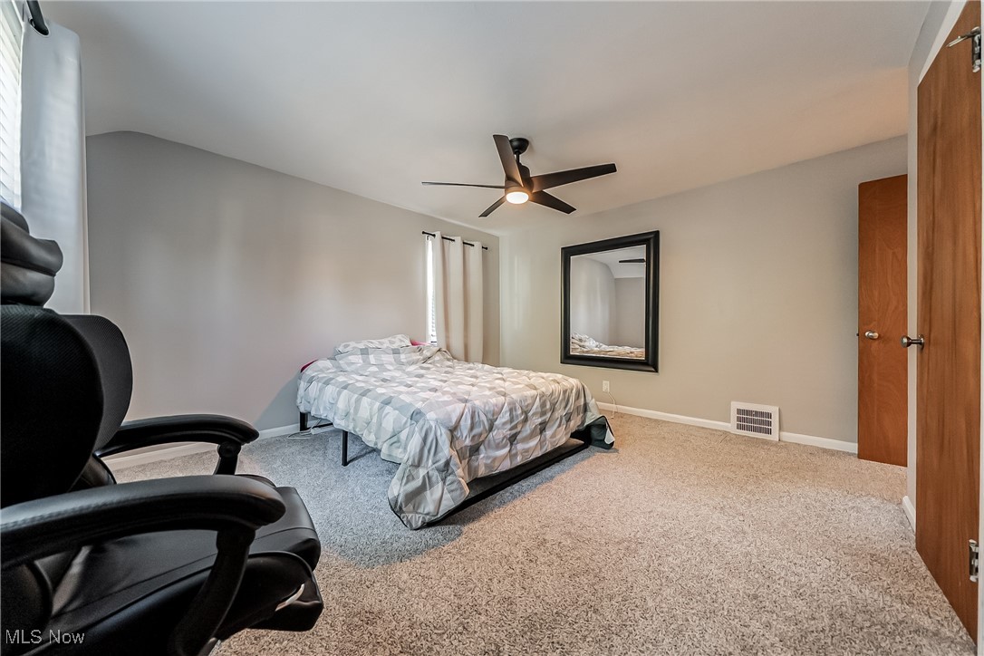 1235 Dorsh Road Cleveland, OH 44121 - Photo 18 of 39 Bedroom with carpet flooring and ceiling fan