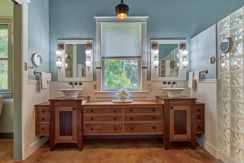 a kitchen with cabinets and window