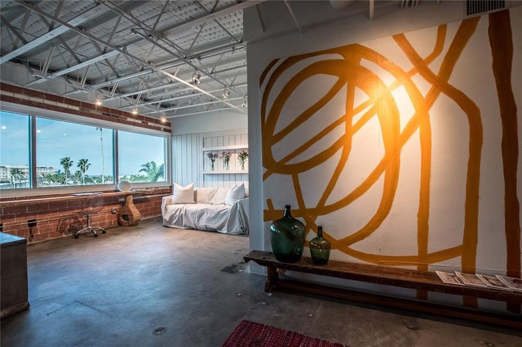 901 North Upper Broadway, Unit 206 Corpus Christi, TX 78401 - Photo 16 of 40 a room with gym equipment and a large window