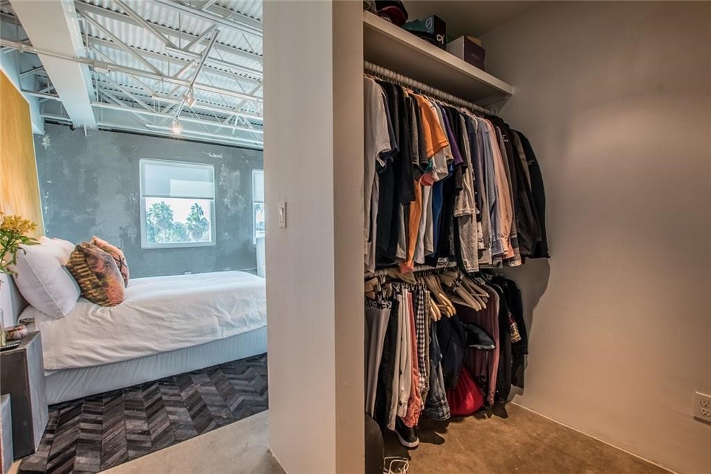 901 North Upper Broadway, Unit 206 Corpus Christi, TX 78401 - Photo 35 of 40 a view of walk in closet with clothes and shoes
