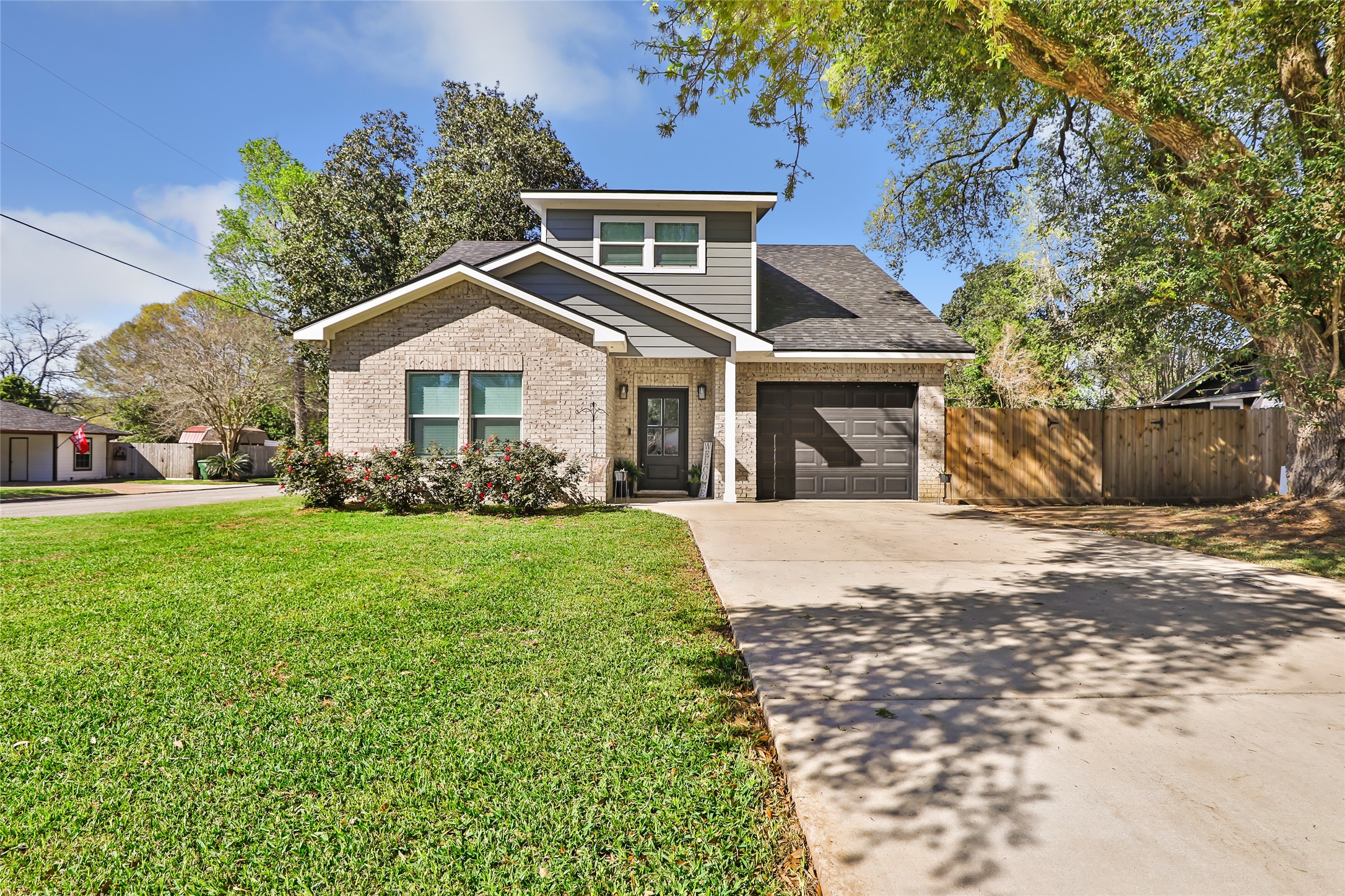 2201 Maple Street Liberty, TX 77575 - Photo 1 of 34 a front view of a house with a garden
