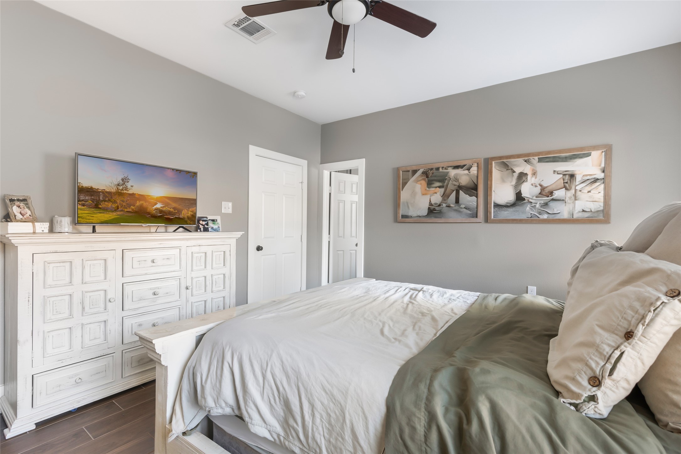 2201 Maple Street Liberty, TX 77575 - Photo 22 of 34 a bedroom with a bed and a flat screen tv