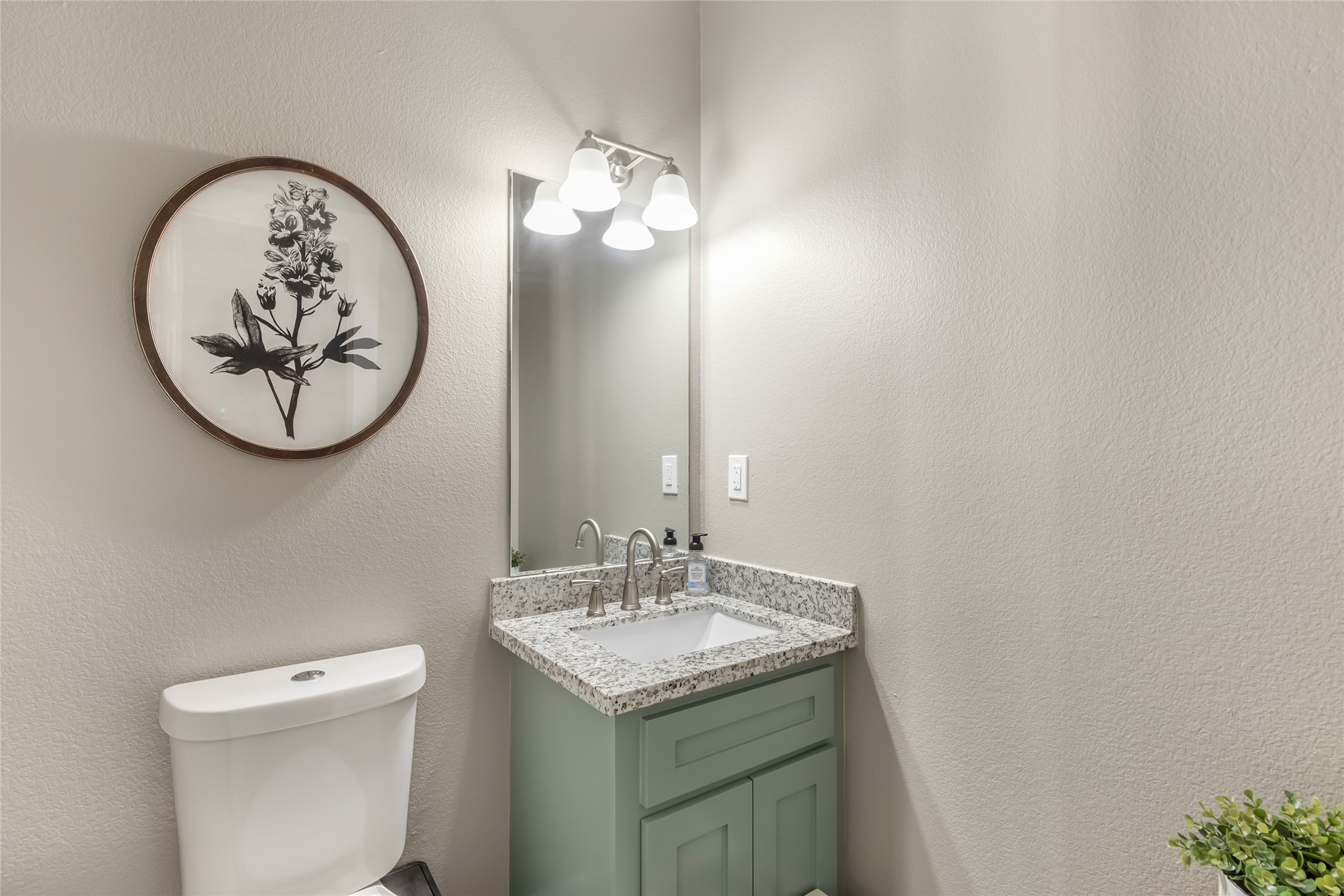 2201 Maple Street Liberty, TX 77575 - Photo 26 of 34 a bathroom with a toilet and a sink