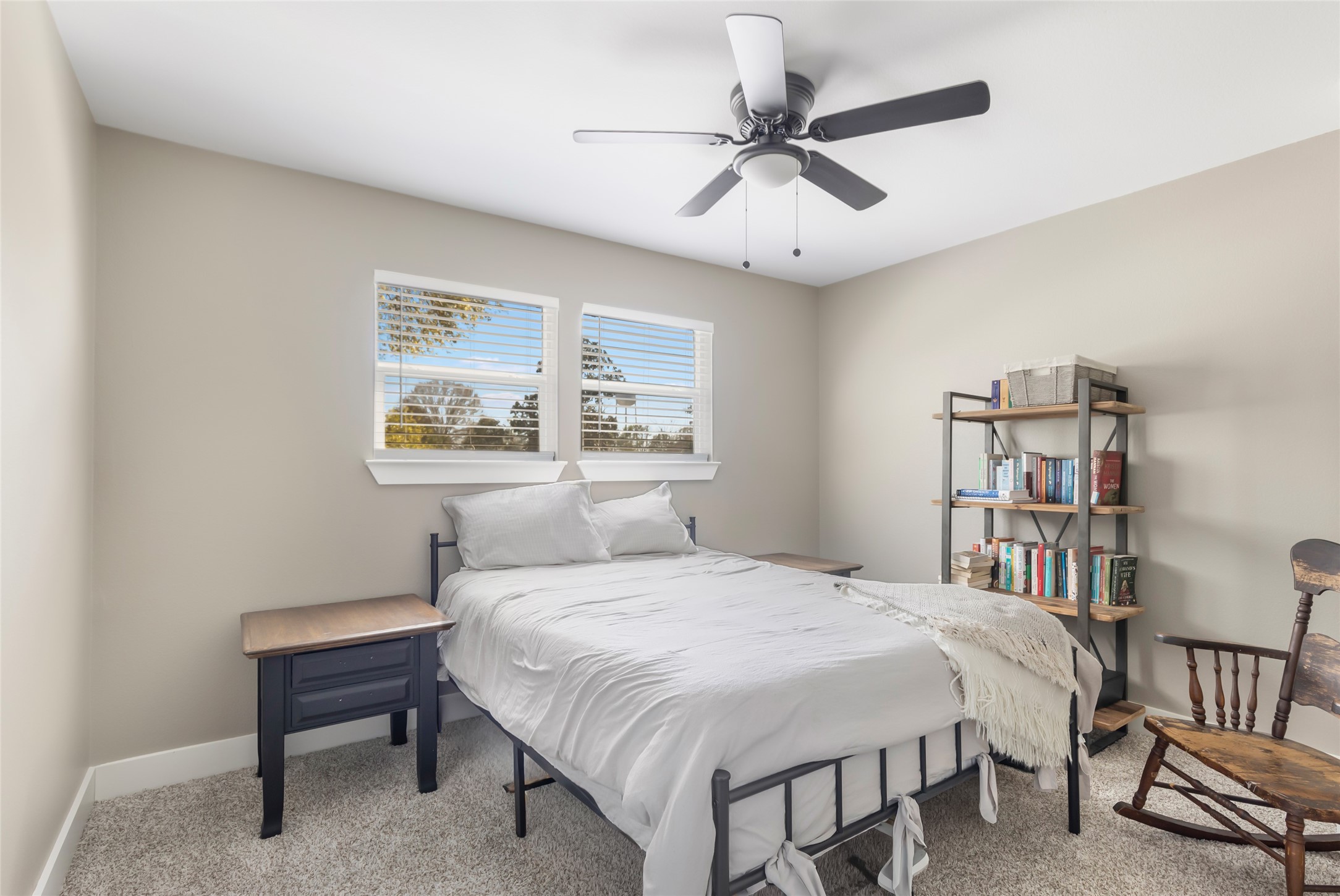 2201 Maple Street Liberty, TX 77575 - Photo 28 of 34 a bedroom with a bed a dresser and a book shelf