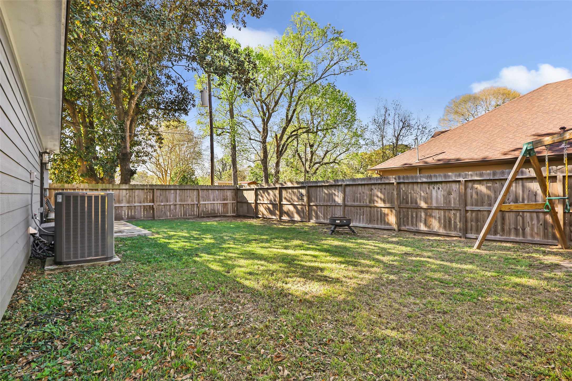 2201 Maple Street Liberty, TX 77575 - Photo 32 of 34 a view of a yard with a house and a yard
