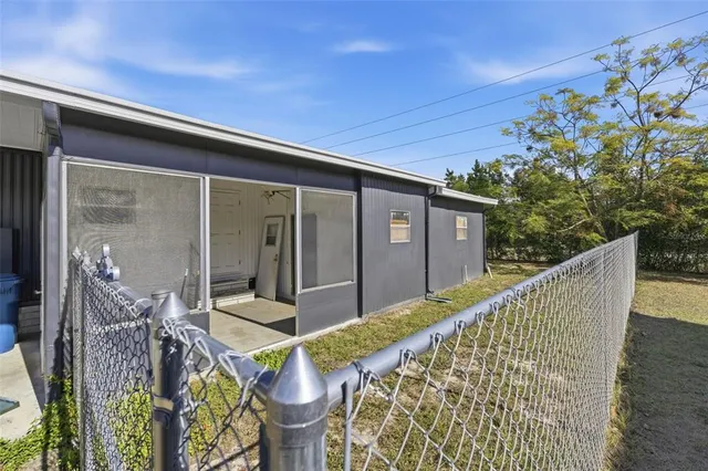 a view of house with backyard