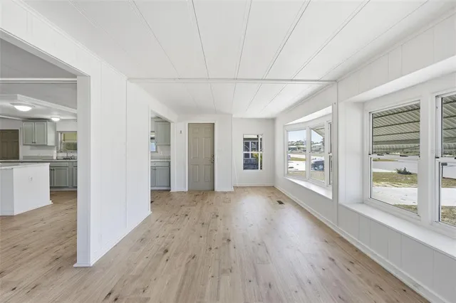 a view of a kitchen with a sink and window