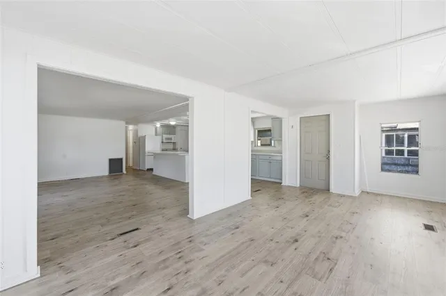 a view of kitchen with wooden floor