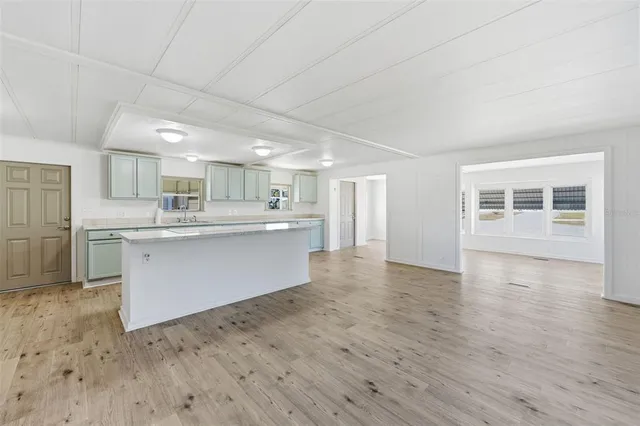 a kitchen with stainless steel appliances granite countertop a stove and a refrigerator