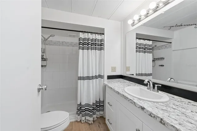 a view of a patio with table and chairs