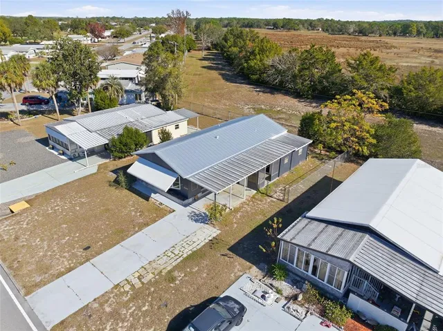 an aerial view of a house with lake view