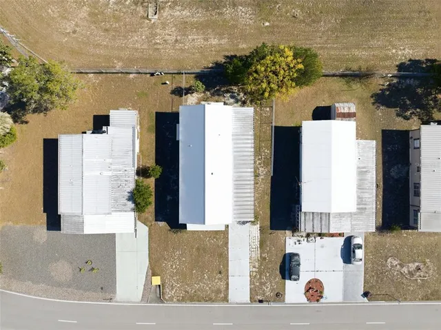 an aerial view of a house with lake view