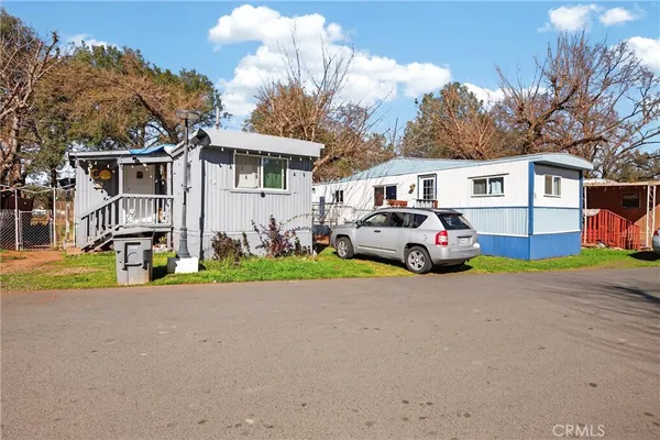 a view of a swimming pool with a yard