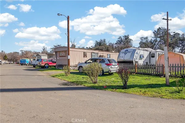 a view of street with parked cars