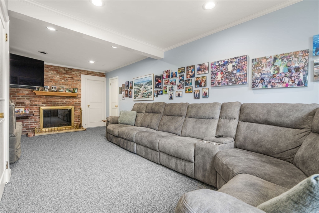 48 Gary Road Needham, MA 02494 - Photo 13 of 20 a living room with a couch and a fireplace