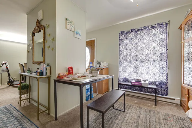 a reading room with furniture and wooden floor