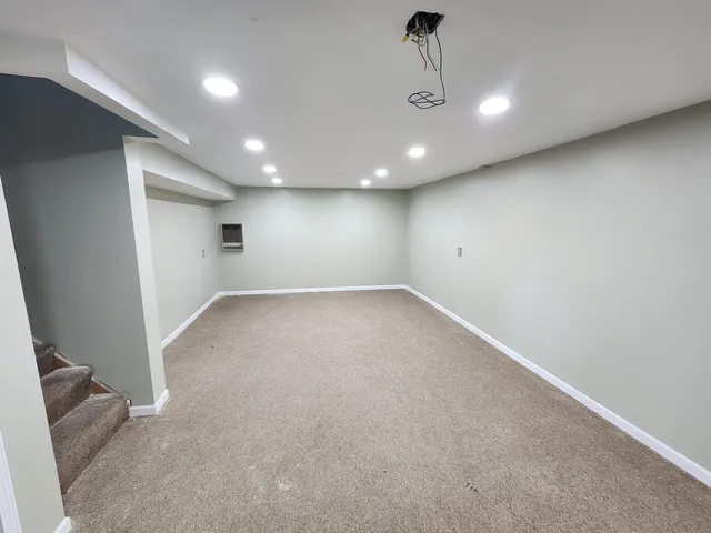 an empty room with a empty space and windows