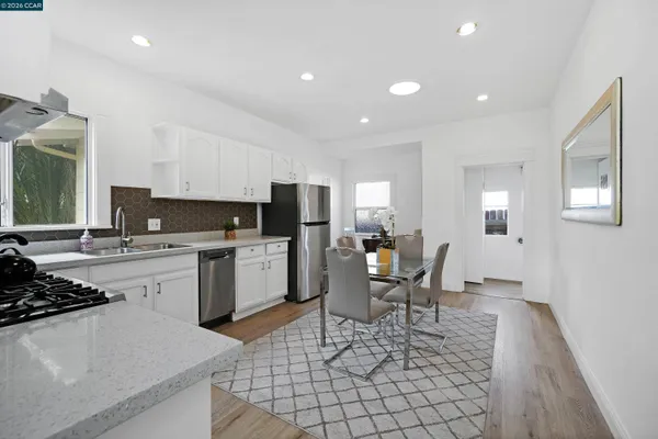 a kitchen with a sink cabinets and stainless steel appliances