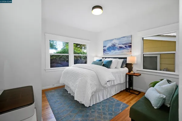 a bedroom with bed and window