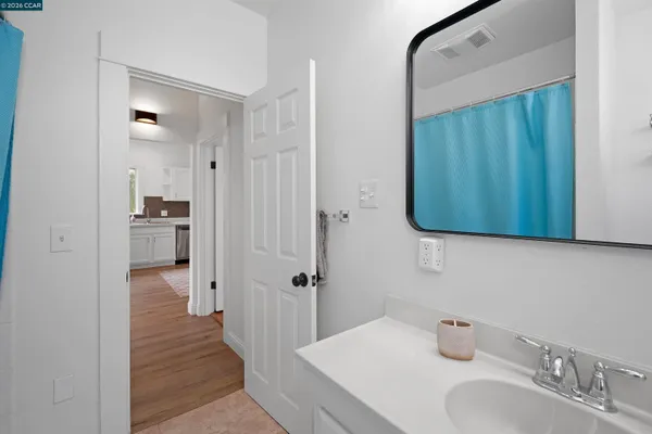 a bathroom with a sink and a mirror