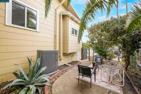 a view of a backyard with sitting area