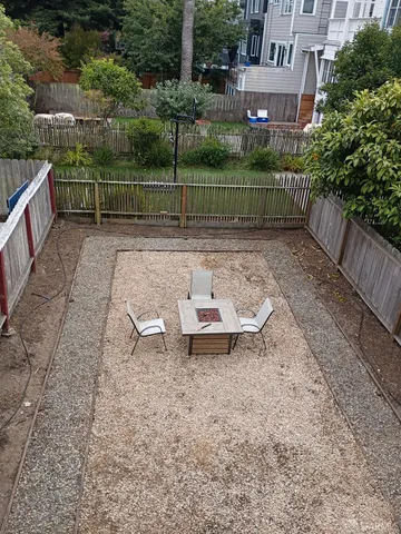 a kitchen with granite countertop a stove sink and cabinets