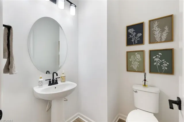 a bathroom with a toilet and sink