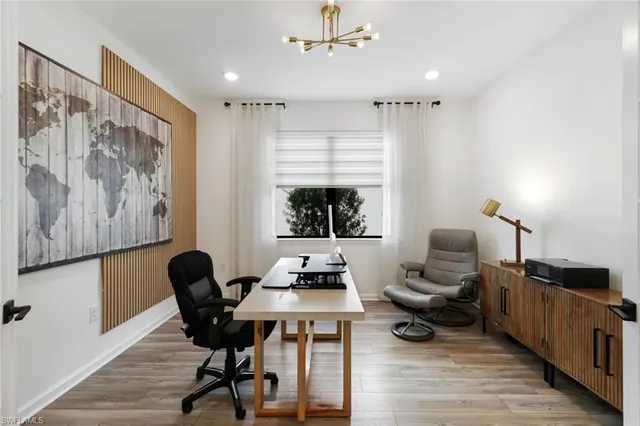 a workspace with furniture and window