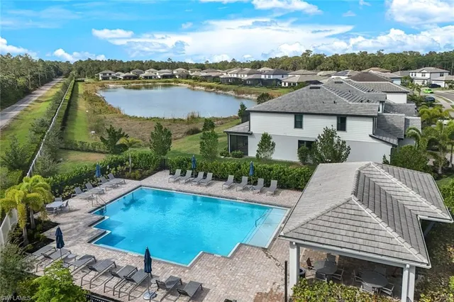 an aerial view of a house with outdoor space lake view and lake view