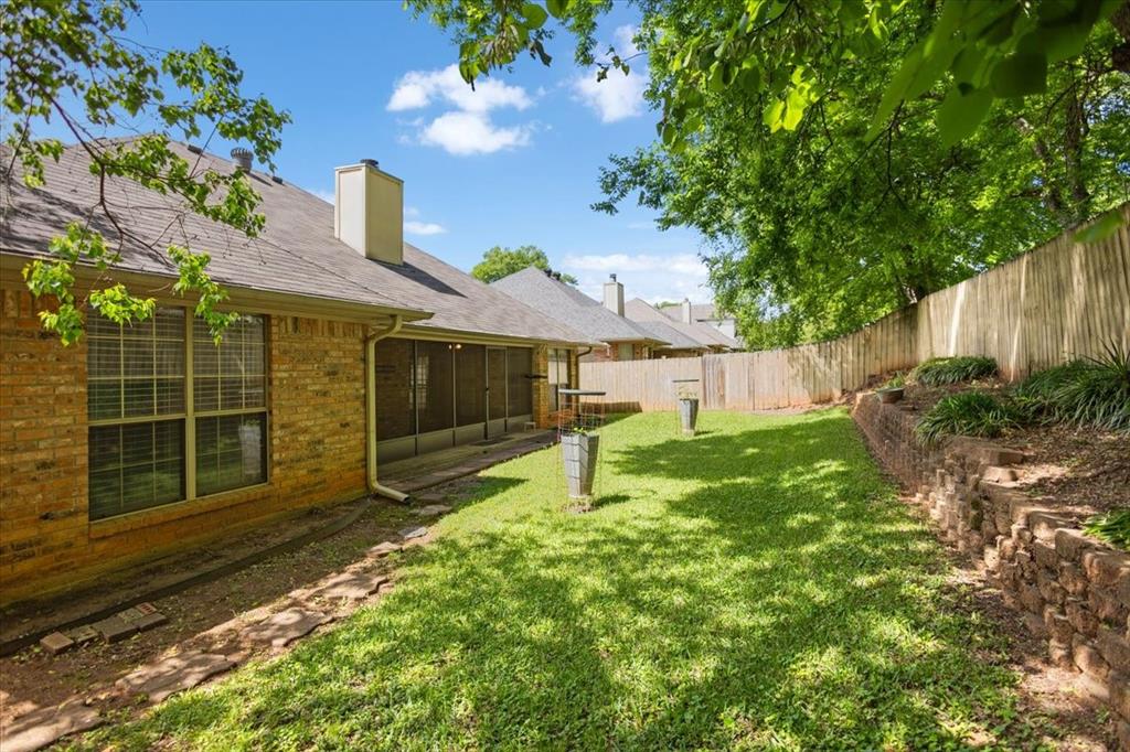 2824 Crestview Avenue Tyler, TX 75701 - Photo 32 of 39 a backyard of a house with lots of green space