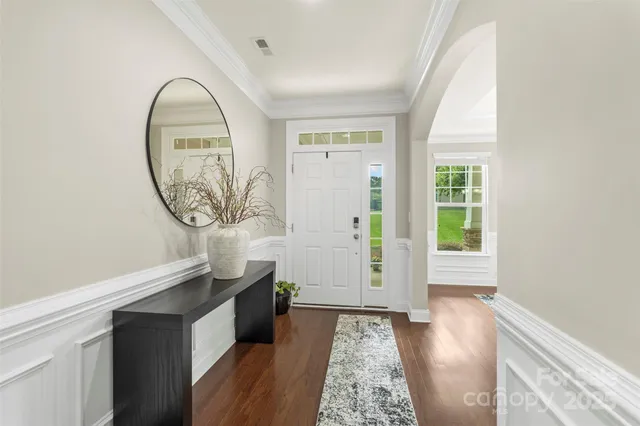 wooden floor with a window in a room