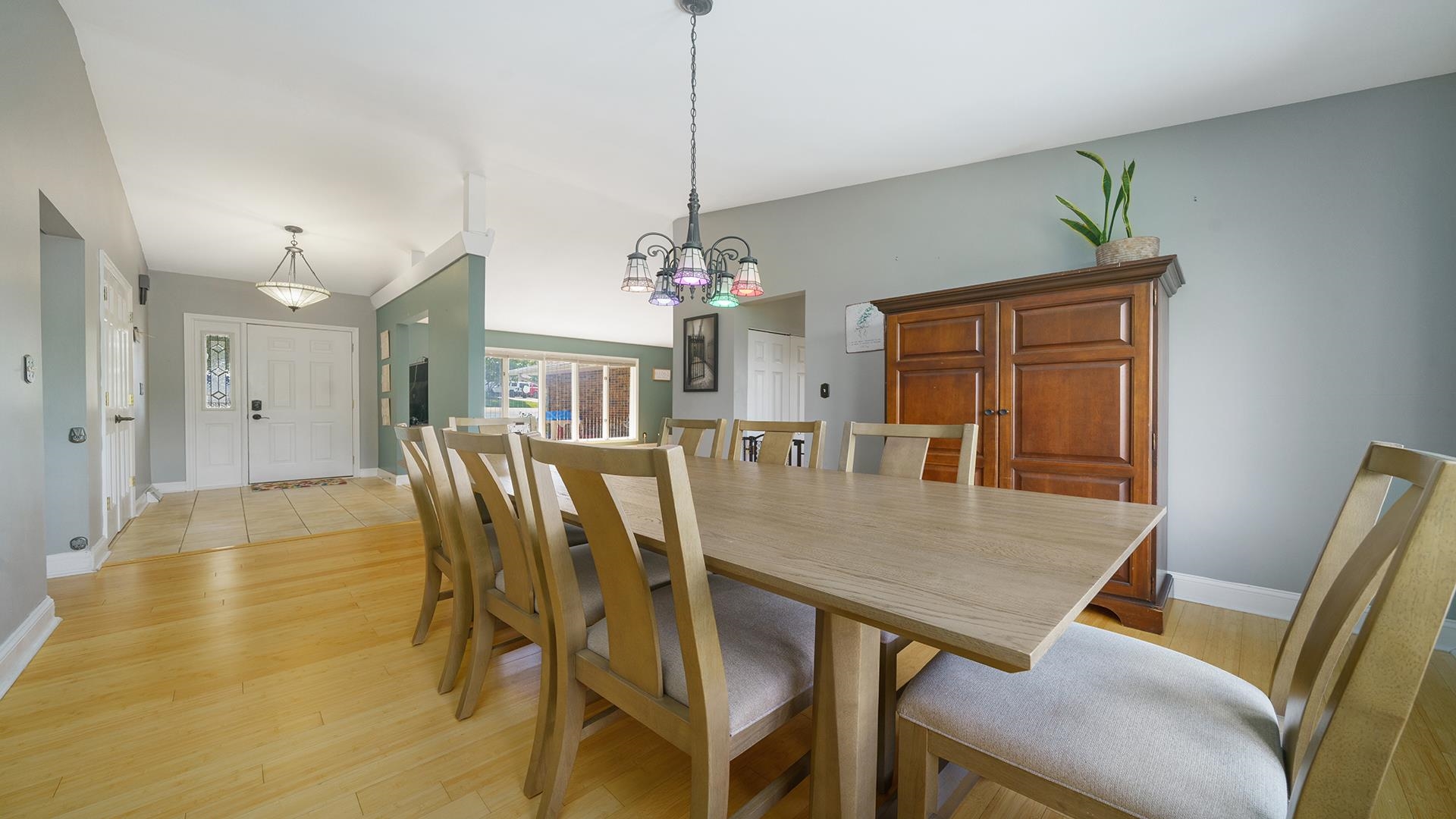 3300 North Silver Ridge Drive Oregon, IL 61061 - Photo 11 of 56 a view of a dining room with furniture and chandelier