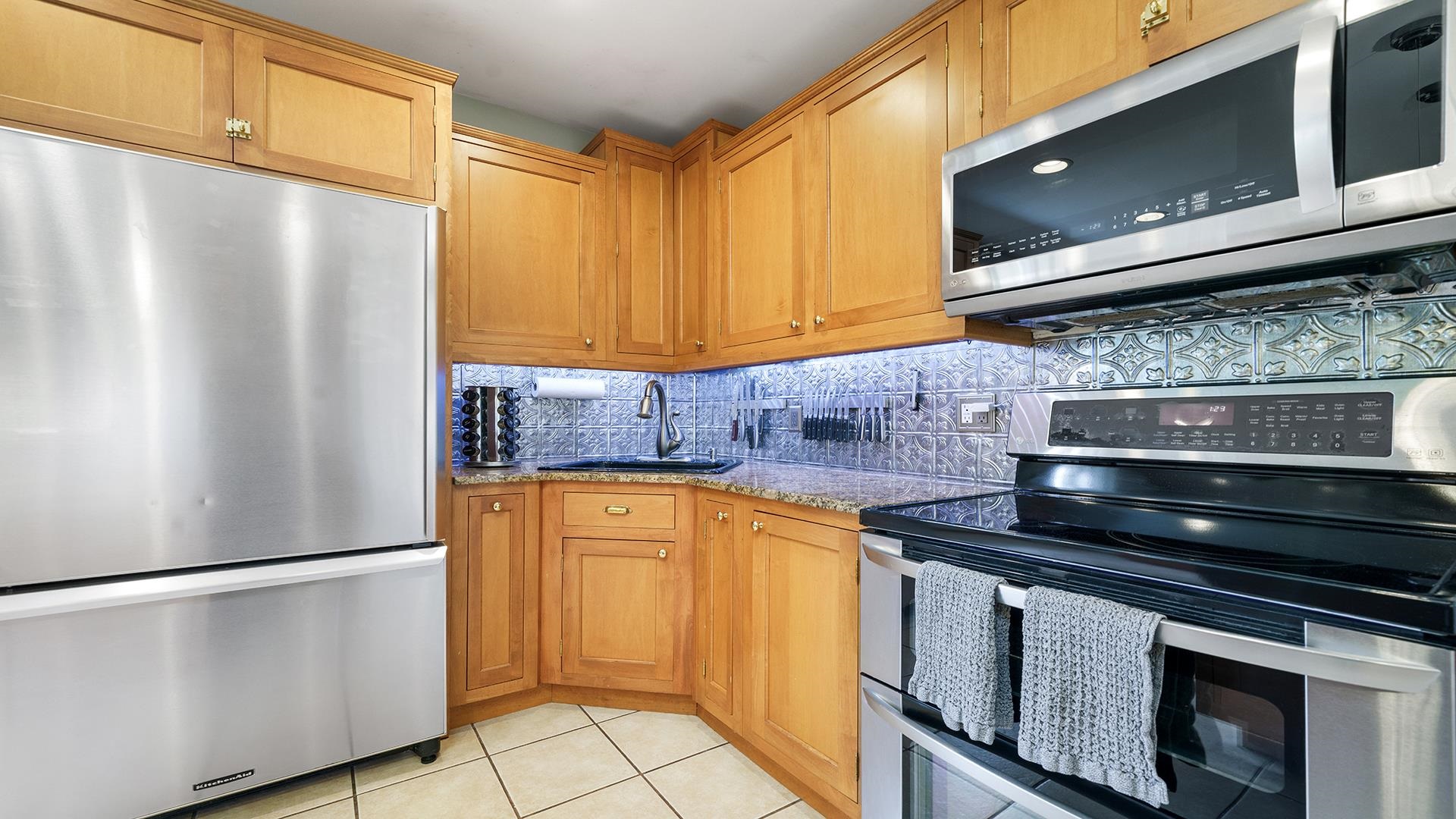 3300 North Silver Ridge Drive Oregon, IL 61061 - Photo 14 of 56 a kitchen with stainless steel appliances a refrigerator sink and cabinets