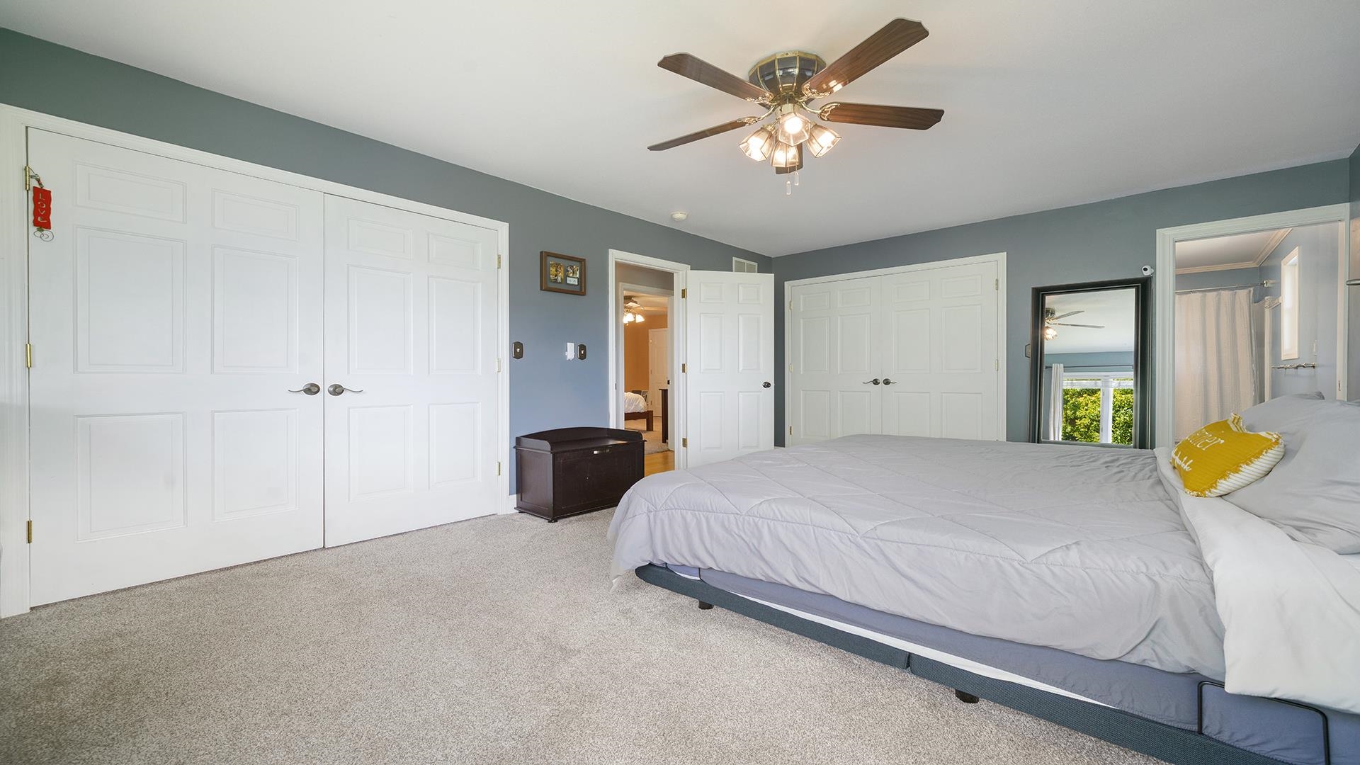 3300 North Silver Ridge Drive Oregon, IL 61061 - Photo 23 of 56 a bedroom with a bed and a chandelier