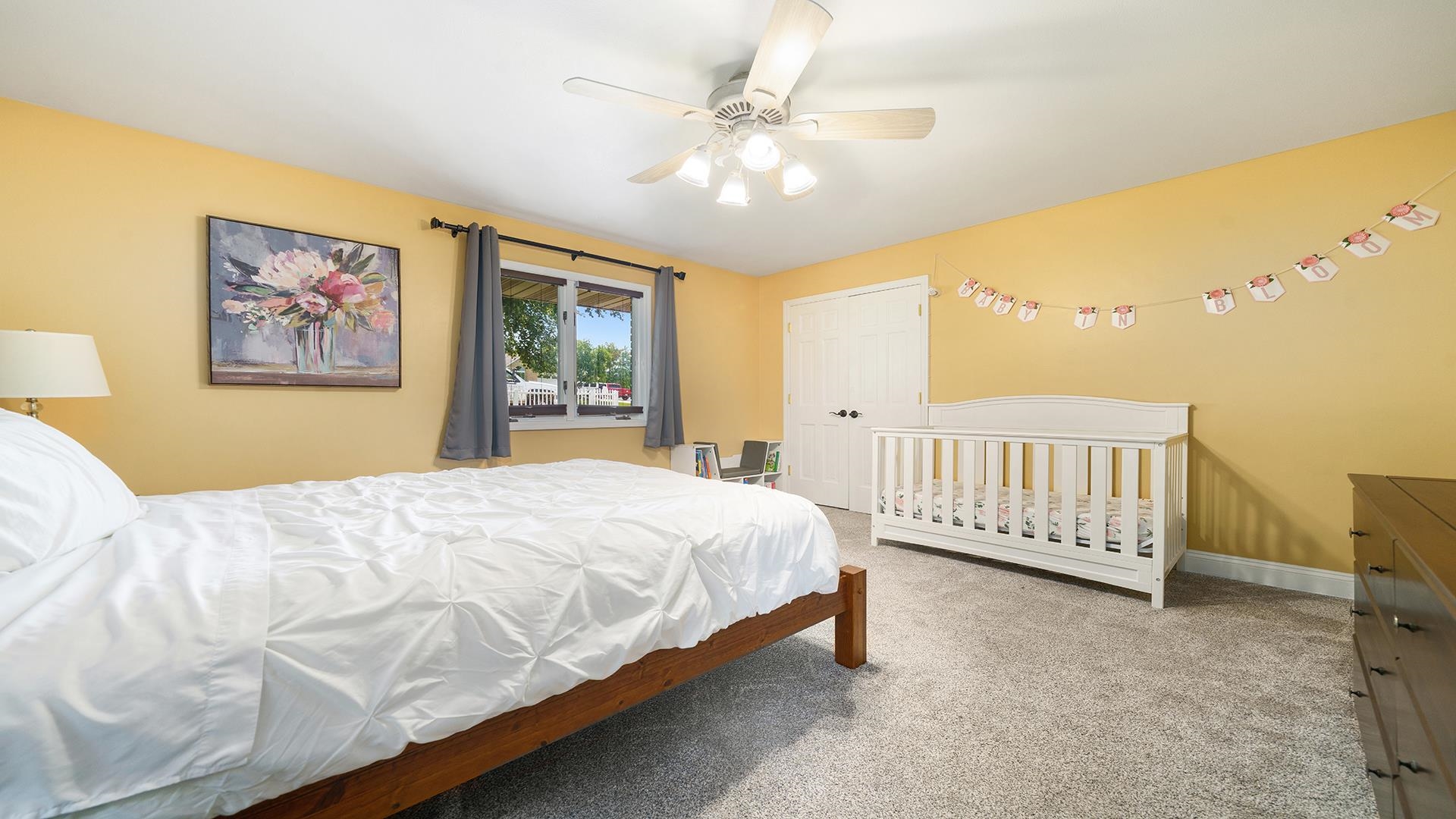 3300 North Silver Ridge Drive Oregon, IL 61061 - Photo 28 of 56 a bedroom with a large bed and a chandelier