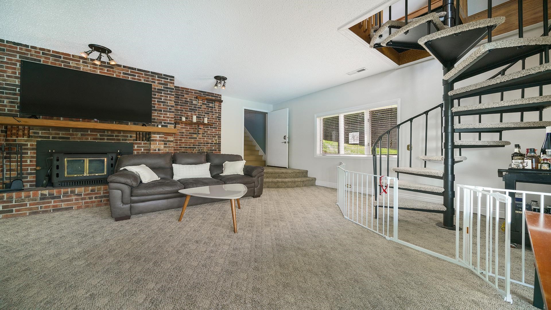 3300 North Silver Ridge Drive Oregon, IL 61061 - Photo 31 of 56 a living room with furniture and a flat screen tv