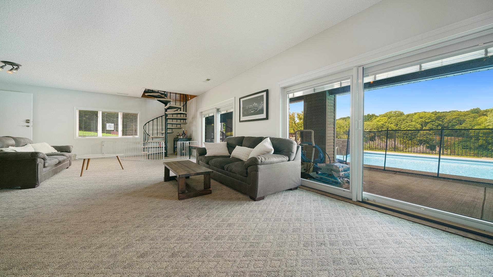 3300 North Silver Ridge Drive Oregon, IL 61061 - Photo 34 of 56 a living room with furniture and a floor to ceiling window