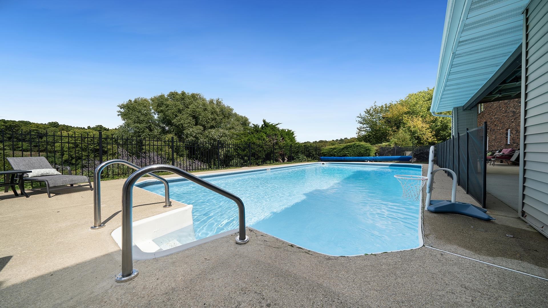 3300 North Silver Ridge Drive Oregon, IL 61061 - Photo 46 of 56 a view of a swimming pool with a patio and a yard