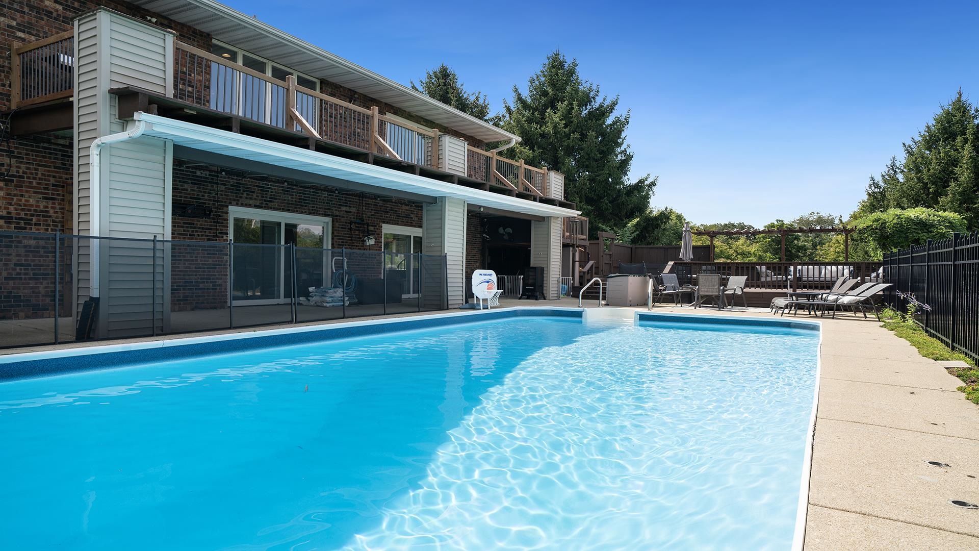 3300 North Silver Ridge Drive Oregon, IL 61061 - Photo 47 of 56 a view of a house with a swimming pool