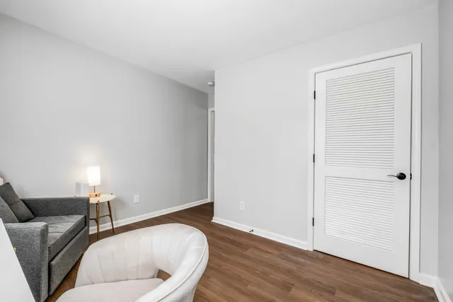 a room with a couch and wooden floor