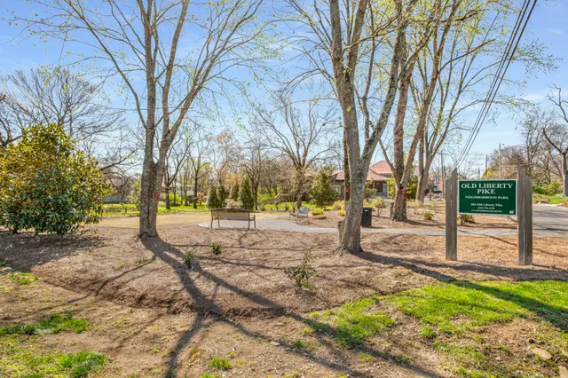 a park bench sitting in the middle of a park