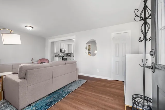 a living room with furniture and a table