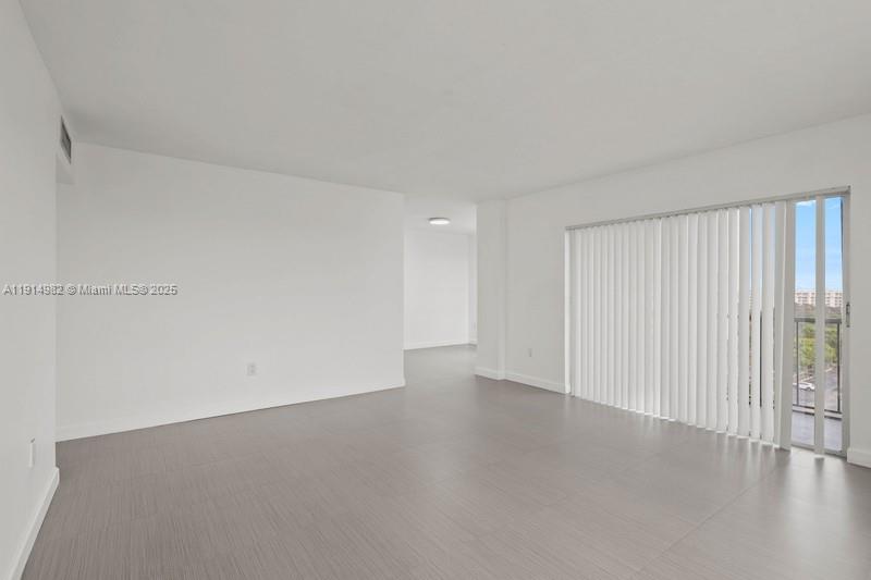 4174 Inverrary Drive, Unit 902 Lauderhill, FL 33319 - Photo 11 of 19 a view of an empty room and wooden floor