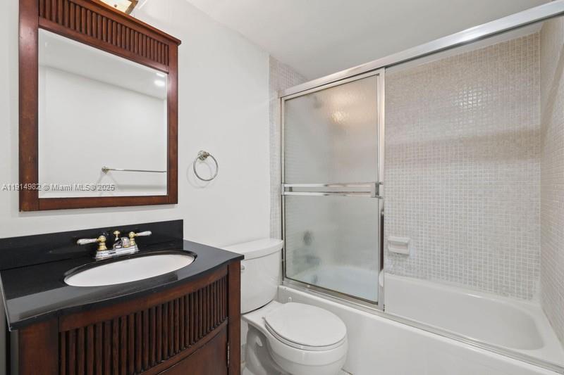 4174 Inverrary Drive, Unit 902 Lauderhill, FL 33319 - Photo 13 of 19 a bathroom with a sink and a mirror